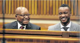  ?? Picture: ALAISTER RUSSELL ?? IN SUPPORT: Jacob Zuma sits next to his son, Duduzane, in the Randburg Magistrate’s Court where Duduzane is facing a culpable homicide charge for crashing his Porsche into a taxi in 2014. Duduzane‚ says he will testify at the state-capture inquiry if required