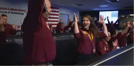  ?? (Reuters) ?? THE MISSION CONTROL team at NASA’s Jet Propulsion Laboratory in Pasadena, California celebrates yesterday as the spaceship Insight lands on the planet’s surface after six months in space.