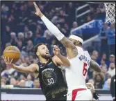  ?? Associated Press ?? Golden State Warriors guard Stephen Curry (30) shoots against Los Angeles Clippers forward Marcus Morris Sr. during the first half on Wednesday in San Francisco. The Warriors won 124-107.