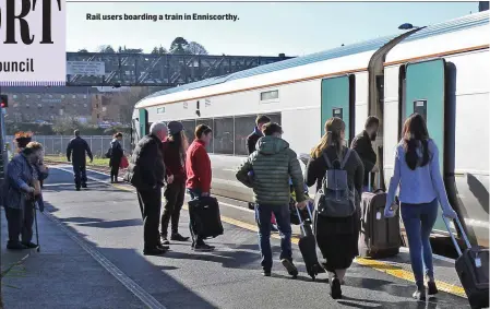  ??  ?? Rail users boarding a train in Enniscorth­y.