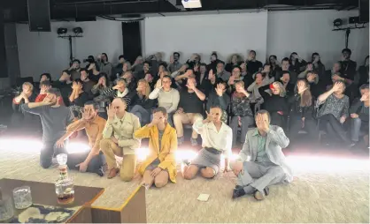  ?? KASZAS/REUTERS ?? Actors and the audience hold up their hands at Budapest’s Trafo threatre in protest against a plan by Hungary’s government to tighten its control over theatres in Budapest, Hungary, Sunday.TAMAS