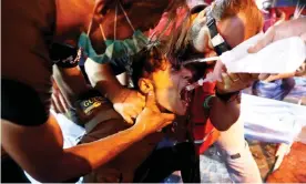  ??  ?? A man receives treatment during a protest in Baghdad. Photograph: Xinhua/Barcroft