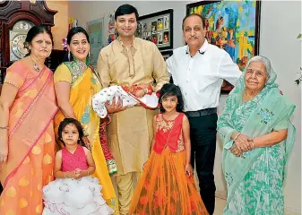  ??  ?? Clockwise: Jyoti Bantia, Mansi Bantia, Amit Bantia holding the newborn Raj Vardhan Bantia, Surender Bantia, Umrao Devi Bantia, Yeshita Bantia and Tanishka Banti