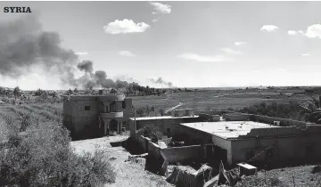  ?? AP ?? Columns of black smoke rise from the last small piece of territory held by Islamic State militants as US-backed fighters pound the area with artillery fire and occasional airstrikes, as seen from outside Baghouz, Syria, yesterday.