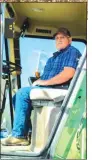  ?? LeAnne Coleman ?? Above, Greg Coleman gears up his combine to begin picking corn with the rest of the crew.