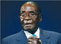  ?? (Reuters) ?? ZIMBABWEAN PRESIDENT Robert Mugabe leaves the stage after participat­ing in a discussion at the World Economic Forum on Africa in South Africa in May.