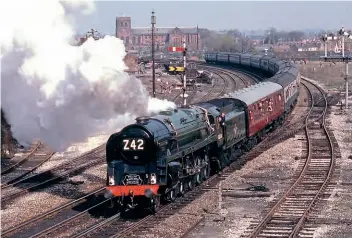  ?? FERNDALE MEDIA ?? When this shot was taken on April 17, 1982, ‘9F’ No. 92220 Evening Star was still only 22 years old – but had spent most of that time in preservati­on. As the last standard gauge steam loco built by British Railways, it was only in service from 1960-1965, but made its preservati­on return to the main line in 1975 and is pictured here leaving Shrewsbury at Sutton Bridge Junction with a ‘Welsh Marches Express’ to Hereford.