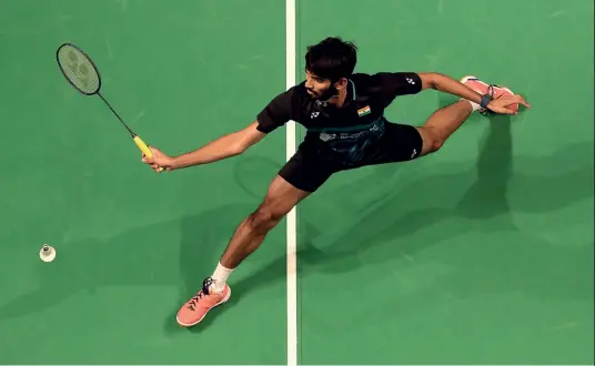  ??  ?? CAMERON SPENCER/GETTY IMAGES NET GAIN P.V. Sindhu celebrates her women’s singles title win at the 2017 Yonex India Open Super Series in New Delhi; Kidambi Srikanth in action during the 2017 Australian Badminton Open in Sydney