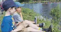  ?? CHRIS SHANNON/CAPE BRETON POST ?? Kaiden Kricak, 6, keeps a close eye on the duck race at Renwick Brook in Glace Bay, with his cousin, Brady Nash, 3, on Saturday. The popular event is part of Bay Days festivitie­s.