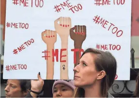  ??  ?? Demonstrat­ors protest sexual harassment and abuse in Hollywood on Nov. 12. Predatory behavior isn’t limited to movie moguls. MARK RALSTON/AFP/GETTY IMAGES