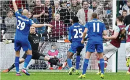  ?? GETTY IMAGES ?? Outstandin­g: Schmeichel denies Carroll at the death