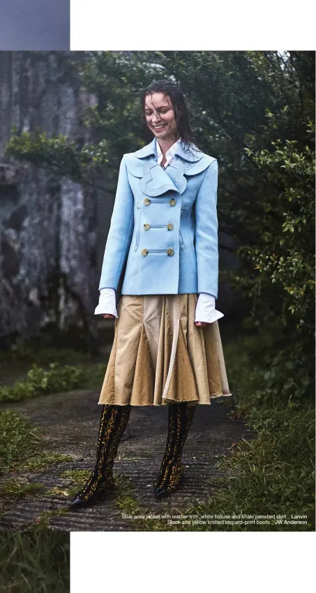  ??  ?? Blue wool jacket with leather trim, white blouse and khaki panelled skirt _ Lanvin Black and yellow knitted leopard-print boots _ JW Anderson