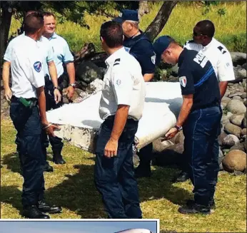  ??  ?? Vital clue? La Reunion Police with the debris yesterday