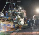  ?? VALERIA FERRARO/AP ?? Police check a boat Saturday in the southern Italian port of Crotone. Italy’s coast guard said it rescued more than 1,000 migrants off the country’s southern mainland in recent days.