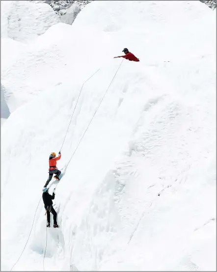  ??  ?? This picture taken on April 24, 2018 shows climbers at Everest Base Camp practicing their techniques on the Khumbu glacier before trying to summit
Everest, some 140 km northeast of the Nepali capital Kathmandu. (AFP)