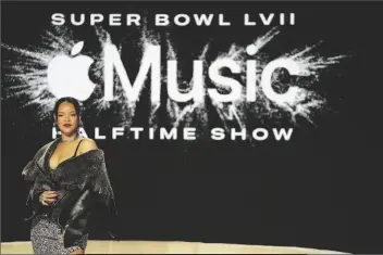  ?? MIKE STEWART/AP ?? RIHANNA POSES FOR A PHOTO AFTER A HALFTIME SHOW news conference ahead of the Super Bowl 57 NFL football game on Thursday in Phoenix.