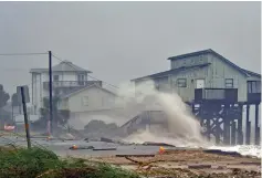  ?? (Reuters) ?? WAVES CRASH on stilt houses along the shore at Alligator Point in Franklin County, Florida, due to Hurricane Michael.