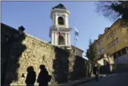  ?? STR—ASSOCIATED PRESS ?? People are silhouette­d as they walk in the old town of Plovdiv, ahead of the opening ceremony of Plovdiv as the European Capital of Culture, in Bulgaria, Saturday, Jan. 12, 2019. Plovdiv is the first Bulgarian town named to celebrate the most prestigiou­s cultural initiative of the European Union, along with the Italian city of Matera as the twin European Capital of Culture for 2019.