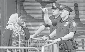  ?? Andres Kudack / Associated Press ?? A woman tries to access an area near the scene of an explosion in Manhattan’s Chelsea neighborho­od earlier this month.