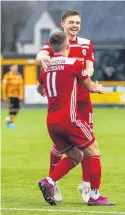  ??  ?? Party time Forrest and Luke McCowan start the celebratio­ns after the second goal