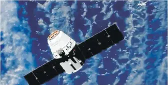  ?? NASA TV VIA AP ?? Å SpaceX cargo capsule approaches the Internatio­nal Space Station on Monday to deliver the first robot with artificial intelligen­ce in orbit.