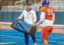  ?? CONTRIBUTE­D ?? Boise State assistant Spencer Danielson directs drills during spring practice in March at Albertsons Stadium.
