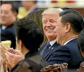  ?? PETER/GETTY IMAGES THOMAS ?? Donald Trump and Xi Jinping last month.