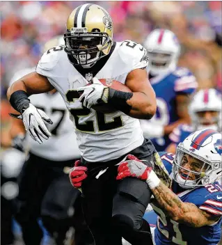  ?? BRETT CARLSEN / GETTY IMAGES ?? Mark Ingram rushed for a career-high three touchdowns and 131 yards as the Saints pounded out a 47-10 road victory over the Bills in Orchard Park, N.Y.