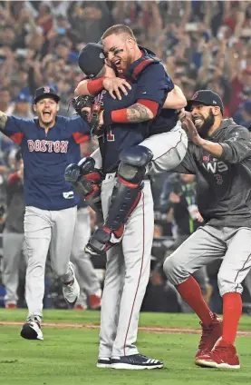  ?? JAYNE KAMIN-ONCEA/USA TODAY SPORTS ?? Chris Sale, left, celebrates with Christian Vazquez and David Price, right, after the Red Sox won the World Series.