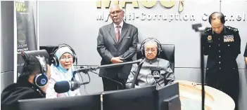  ??  ?? Dr Mahathir (seated right) with his deputy Datuk Seri Dr Wan Azizah Wan Ismail during an interview with Malaysian Anti-Corruption Commission radio channel in Putrajaya. — Bernama photo