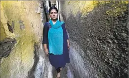  ?? Rajanish Kakade Associated Press ?? SHEELA SINGH, 39, shown outside her home in a shanty area in Mumbai last month, resigned from her job as a social worker because of pressure from family.