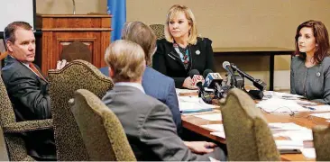  ?? [AP PHOTO] ?? Oklahoma Gov.Mary Fallin, center, presides over a Board of Equalizati­on meeting in Oklahoma City on Tuesday. Lt. Gov. Todd Lamb is at left and Joy Hofmeister, state schools superinten­dent is at right.