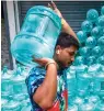 ?? — PTI ?? Residents have been forced to buy water at exhorbitan­t prices in Bengaluru due to the current crisis.