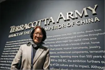  ?? STEVE HELBER — THE ASSOCIATED PRESS ?? In a Tuesday photo, Li Jian, curator of the Terracotta Army soldiers on exhibit at the Virginia Museum of Fine Arts, poses at the start of the exhibit at the museum in Richmond, Va. The Museum has 10 of the majestic terracotta figures on display as...