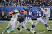  ?? SETH WENIG - THE ASSOCIATED PRESS ?? File-This Dec. 15, 2019, file photo shows New York Giants quarterbac­k Eli Manning (10) passing against the Miami Dolphins during the second quarter of an NFL football game, in East Rutherford, N.J.