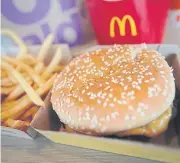  ??  ?? A Quarter Pounder hamburger is served at a McDonald’s restaurant in Effingham, Illinois on Thursday.