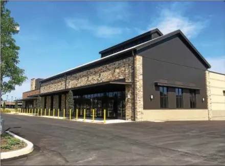  ?? PETE BANNAN – DIGITAL FIRST MEDIA ?? The exterior of a new Whole Foods in Exton is complete but the chain has yet to do work on the interior. It now appears the store won’t open until next year.