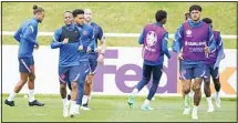  ?? (AP) ?? England’s Raheem Sterling, (left), and Tyrone Mings during a training session at St George’s Park, Burton upon Trent, England, ahead of their Euro 2020 soccer championsh­ip final match against Italy at Wembley Stadium on Sunday.