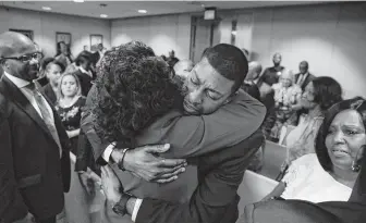  ?? Rose Baca / Dallas Morning News via AP ?? Jordan Edwards’ father, Odell, embraces Dallas County District Attorney Faith Johnson after former Balch Springs police officer Roy Oliver was found guilty of murder in Jordan’s death.