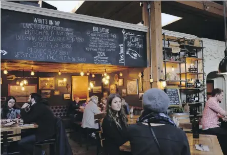  ?? JIM BYERS ?? Belgard Kitchen and Postmark Brewing operate inside the restored Settlement Building — once a steel plant — in Railtown.