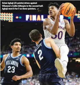  ?? AP ?? Ochai Agbaji (21 points) drives against Villanova’s Collin Gillespie in the second half. Agbaji went 6-for-7 on three-pointers.