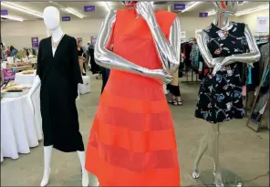  ?? (Arkansas Democrat-Gazette/Helaine R. Williams) ?? A trio of mannequins, clad in dresses for sale, greets buyers at the Sip & Shop Preview Party for the sixth Pop Up Shop benefiting Women and Children First in 2019.