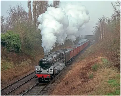  ?? CHRIS MILNER ?? STANDARD FREIGHT: In a timeless scene, BR ‘5MT’ 4-6-0 No. 73156 is about to go under the A6 road bridge with the 11.50 fitted freight to Leicester North on January 15.