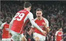  ?? REUTERS ?? Leandro Trossard runs toward teammate Kai Havertz to celebrate netting Arsenal’s equalizer on Tuesday.