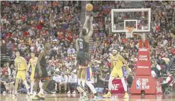  ??  ?? Houston Rockets guard James Harden (second right) makes a three point basket during the fourth quarter against the Los Angeles Lakers at Toyota Center. — USA TODAY Sports photo