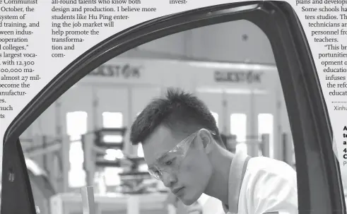  ??  ?? A Chinese contestant works on a car door at the 44th WorldSkill­s Competitio­n.