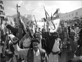  ?? AP PHOTO/HANI MOHAMMED ?? Yemeni Shiite Houthis hold their weapons as they chant slogans during a protest against U.S. President Donald Trump’s Mideast plan in Sanaa, Yemen, on Jan. 31.