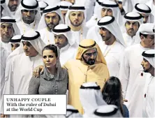  ??  ?? UNHAPPY COUPLE With the ruler of Dubai at the World Cup