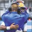  ?? University of New Haven Athletics ?? New Haven coach Chris Pincince hugs Ajee Patterson as he comes off the field on Saturday.