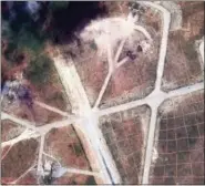  ?? DIGITAL GLOBE VIA THE ASSOCIATED PRESS ?? This satellite image provided by DigitalGlo­be shows an image captured on April 7 of the northwest side of the Shayrat air base in Syria, following U.S. Tomahawk Land Attack Missile strikes on Friday from the USS Ross (DDG 71) and USS Porter (DDG 78)....
